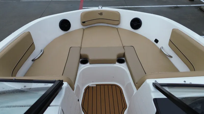 Slide: The Image of Interior of 2026 Bayliner VR6OB with beige seating. - 29