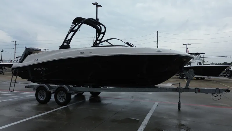 Slide: The Image of 2026 Bayliner VR6OB boat on trailer parked outdoors. - 6