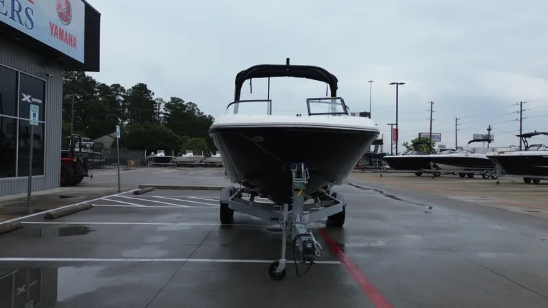 Slide: The Image of 2026 Bayliner VR6OB boat on trailer outdoors. - 8