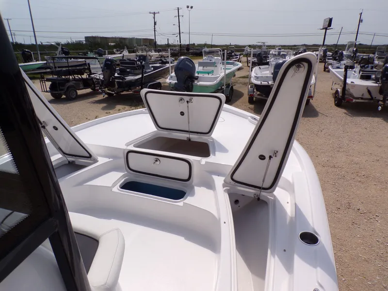 Slide: The Image of 2026 Tidewater 2210 Carolina Bay with open storage compartments at the dock. - 26