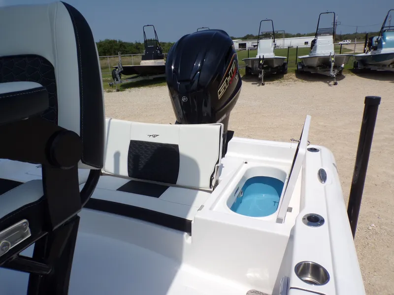Slide: The Image of 2026 Tidewater 2210 Carolina Bay boat with motor and seating area. - 37