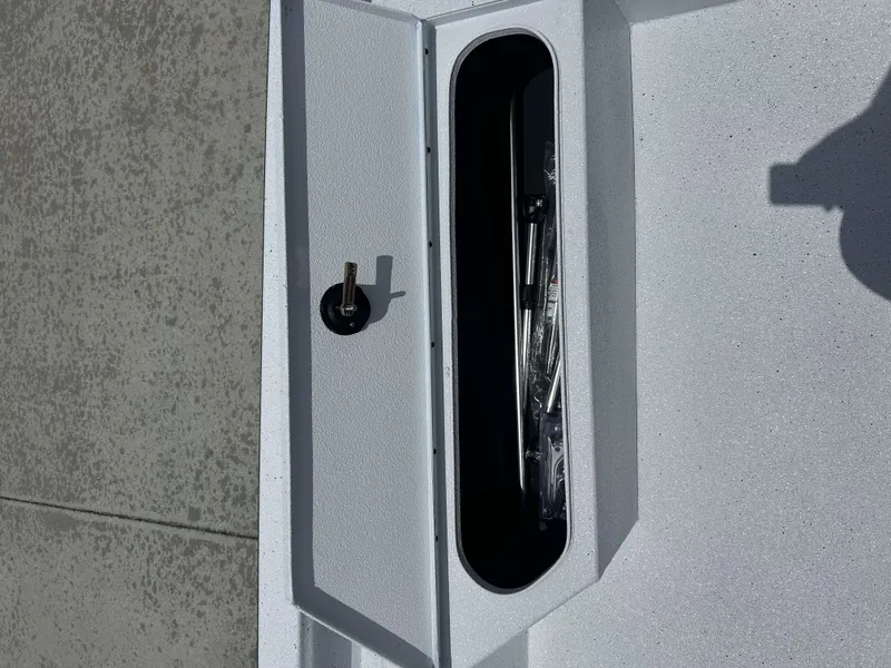 Slide: The Image of Xpress SW22B 2026 boat hatch with storage compartment. - 12