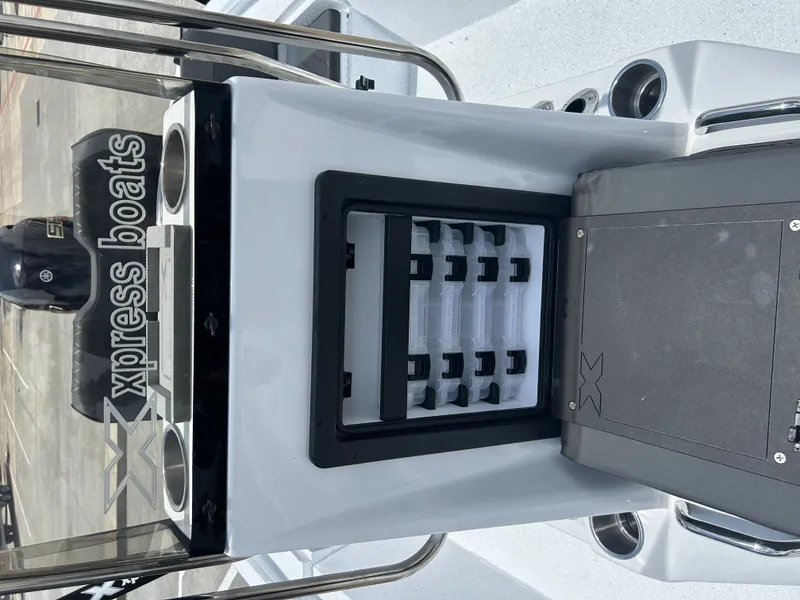 Slide: The Image of Xpress SW22B 2026 boat console with storage and engine. - 14