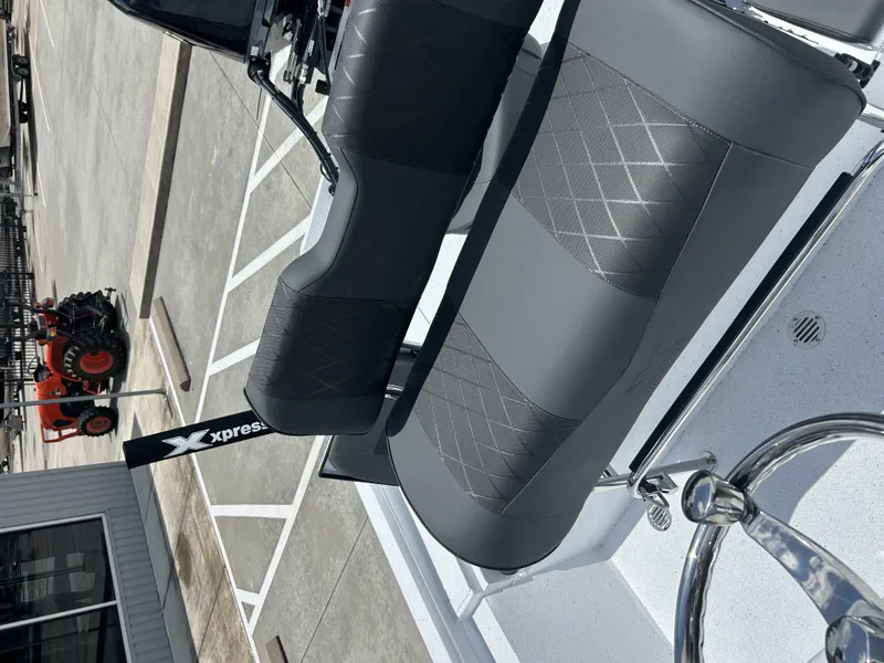 Slide: The Image of Xpress SW22B 2026 boat with modern seating and steering wheel. - 17