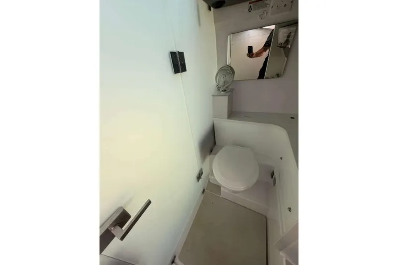 Slide: The Image of Interior of 2021 Axopar Brabus 37 XC Cross Cabin bathroom with modern fixtures. - 30