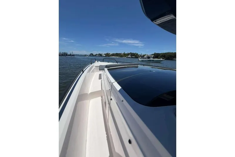 Slide: The Image of 2021 Axopar Brabus 37 XC Cross Cabin cruising on a sunny day. - 37