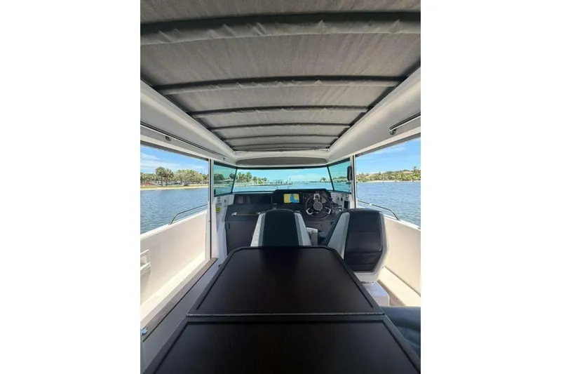 Slide: The Image of Interior view of 2021 Axopar Brabus 37 XC Cross Cabin boat on water. - 44