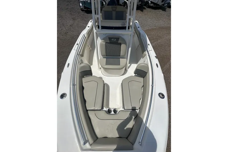 Slide: The Image of 2025 Key West 219 FS boat interior with cushioned seating and sleek design. - 12