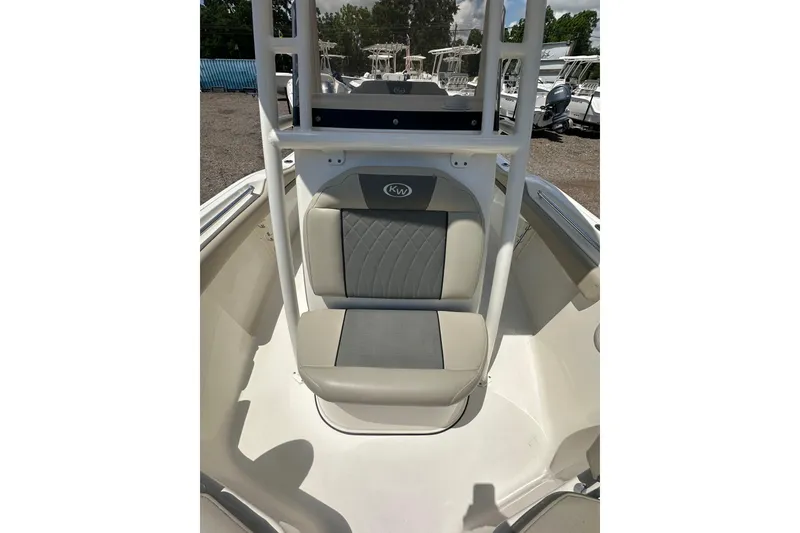 Slide: The Image of 2025 Key West 219 FS boat seat with gray and white upholstery. - 13