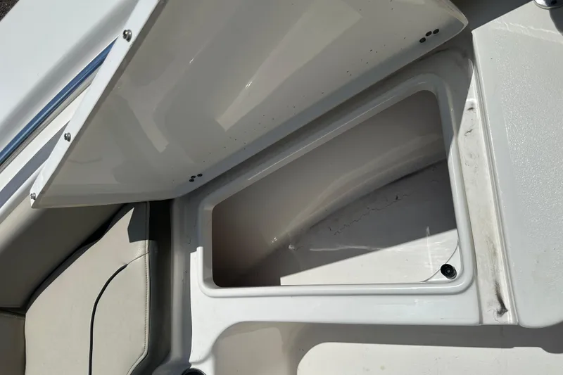 Slide: The Image of Open storage compartment on a 2025 Key West 219 FS boat, showcasing interior space. - 15