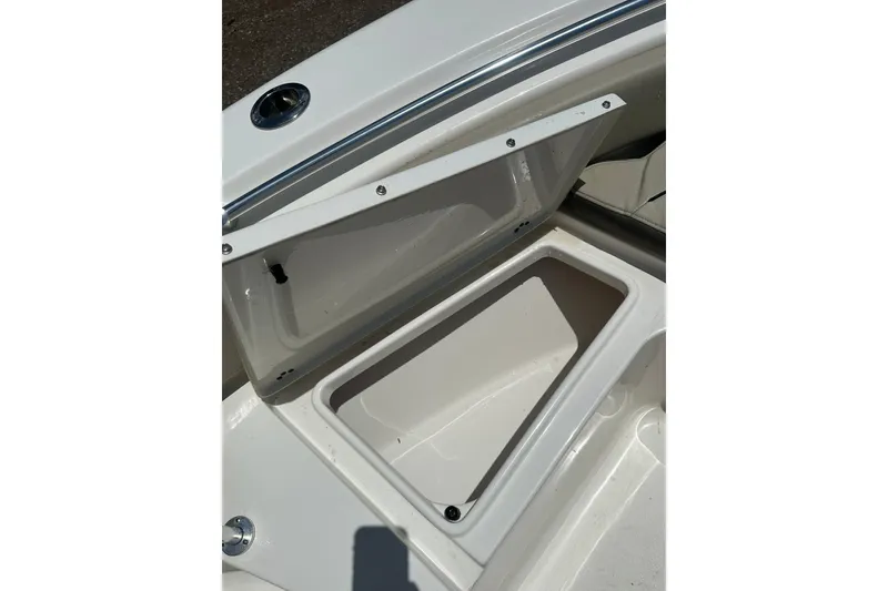 Slide: The Image of Open storage compartment on 2025 Key West 219 FS boat, showcasing interior space. - 16