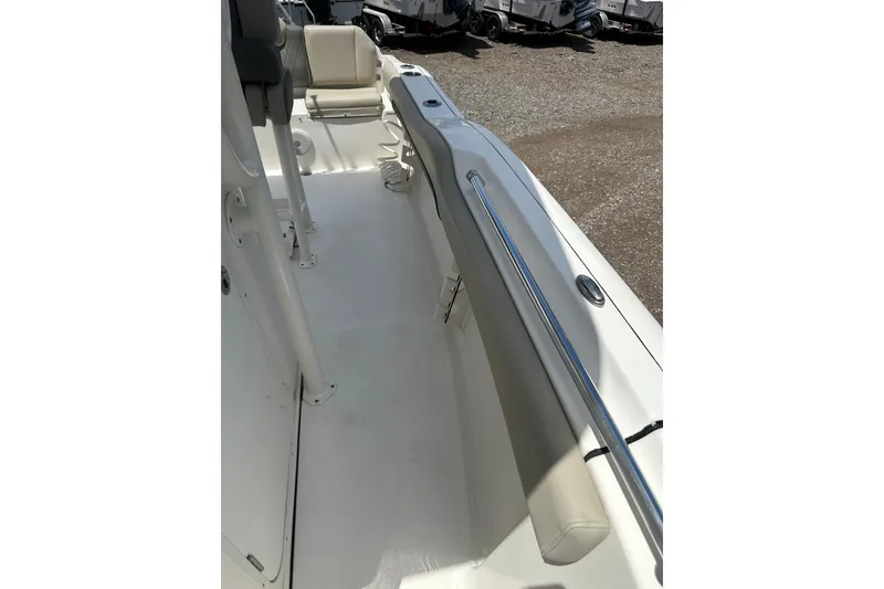Slide: The Image of 2025 Key West 219 FS boat interior with seating and railings. - 17