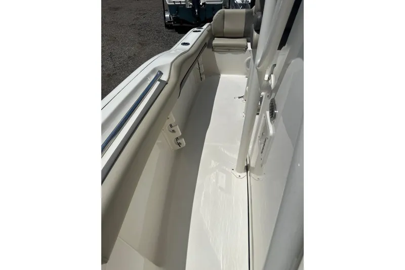 Slide: The Image of 2025 Key West 219 FS boat interior, featuring sleek white seating and modern design elements. - 18