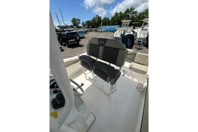 Slide: The Image of 2025 Key West 219 FS boat interior with seating and steering wheel. - 20