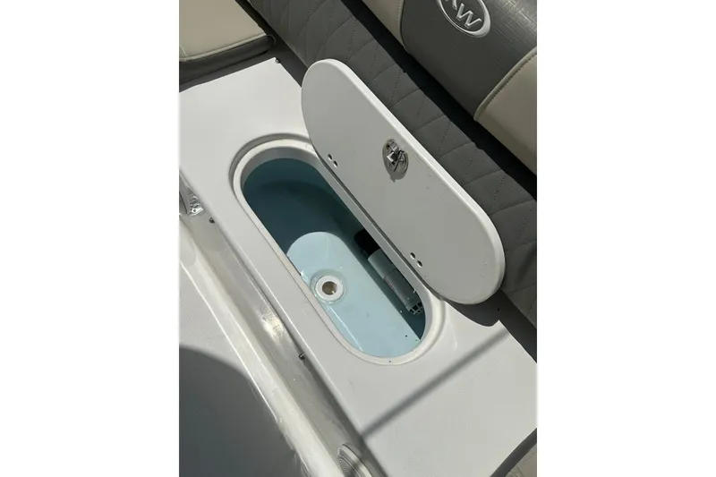 Slide: The Image of Open storage compartment on 2025 Key West 219 FS boat, featuring a sleek design. - 22