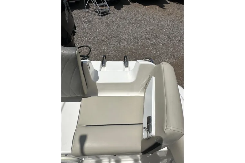 Slide: The Image of 2025 Key West 219 FS boat seat with beige upholstery and white accents. - 23