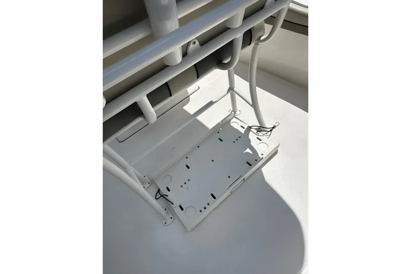 Slide: The Image of 2025 Key West 219 FS boat interior, featuring a white metal frame and wiring. - 24