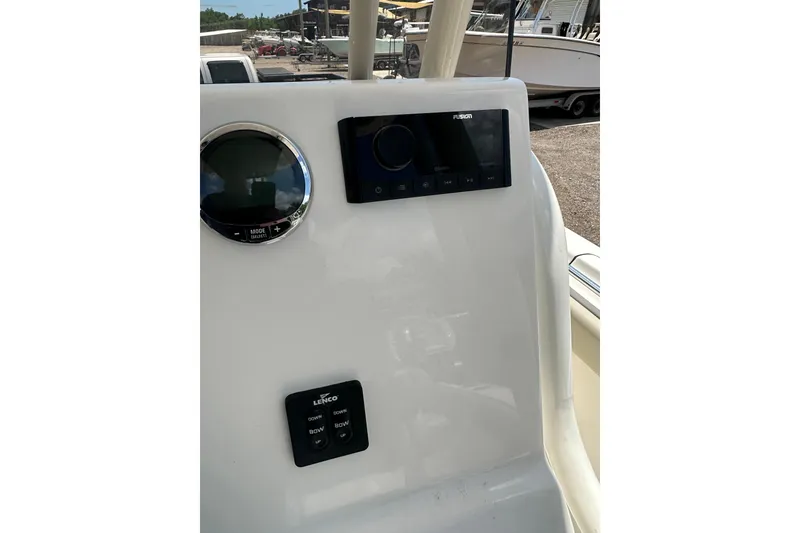 Slide: The Image of 2025 Key West 219 FS boat dashboard with controls and display panel. - 27