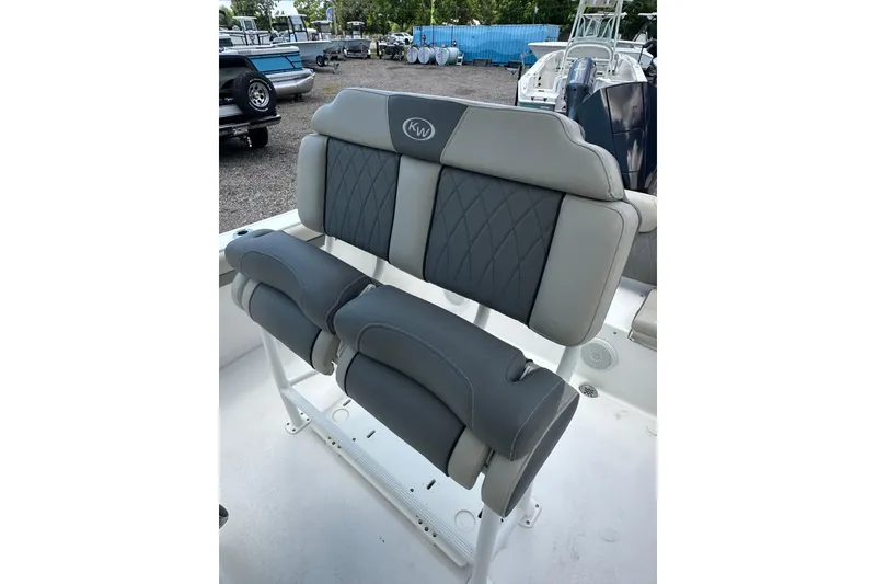Slide: The Image of 2025 Key West 219 FS boat seating with gray cushioned upholstery and diamond stitching. - 32