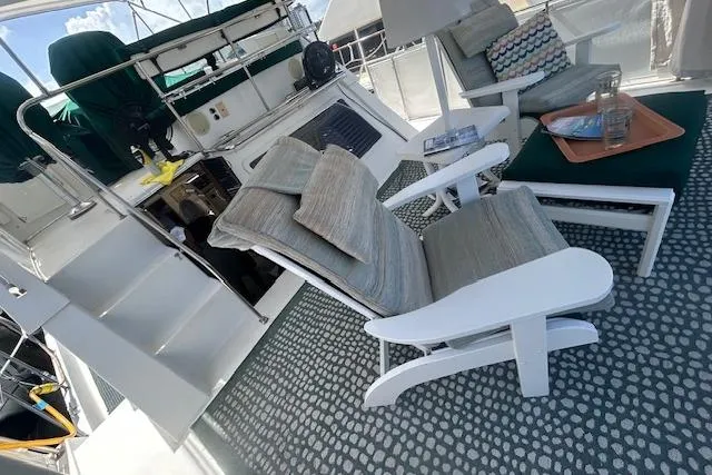 Slide: The Image of 1994 Tollycraft 45 Cockpit Motor Yacht interior with comfortable seating and nautical decor. - 10