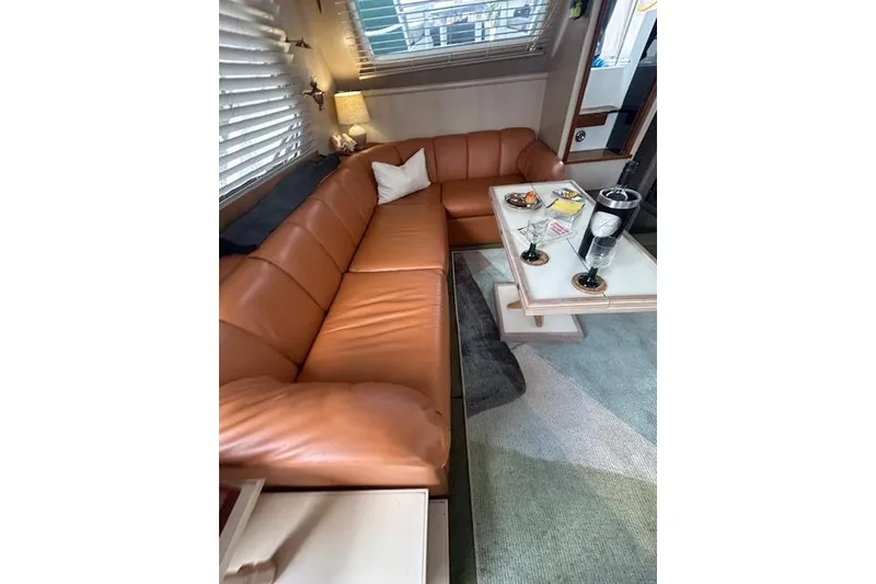 Slide: The Image of Luxurious interior of 1994 Tollycraft 45 Cockpit Motor Yacht with leather seating and elegant decor. - 24