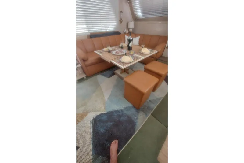 Slide: The Image of Interior of 1994 Tollycraft 45 Cockpit Motor Yacht with dining setup. - 25