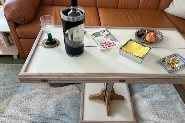 Slide: The Image of Coffee table with wine, glass, book, and snacks on Tollycraft 45 Cockpit Motor Yacht, 1994. - 26