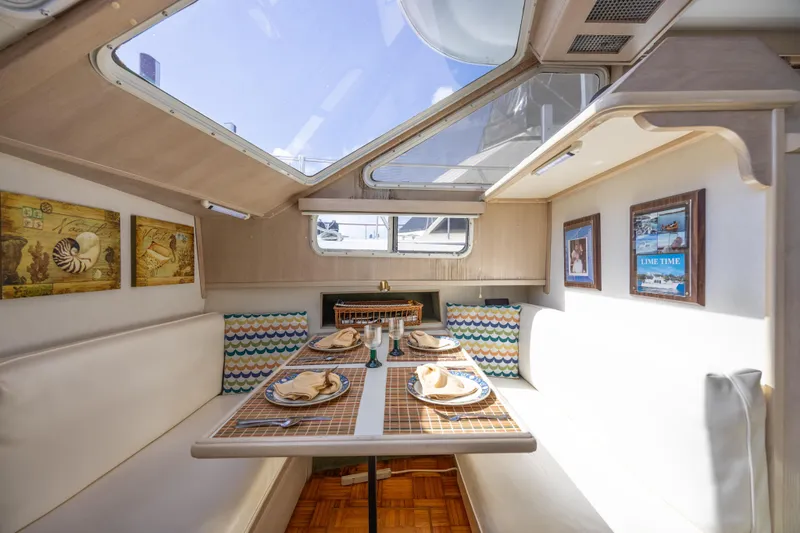 Slide: The Image of Interior of 1994 Tollycraft 45 Cockpit Motor Yacht with dining area and nautical decor. - 34