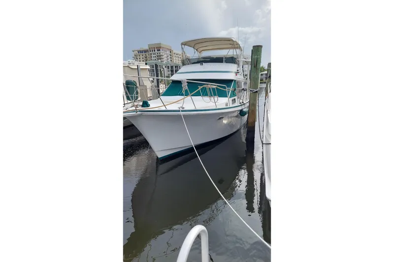 Slide: The Image of 1993 Tollycraft 45 Cockpit Motor Yacht docked at marina. - 4