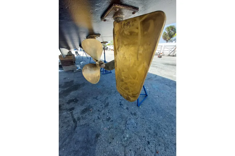 Slide: The Image of Propeller and rudder of 1993 Tollycraft 45 Cockpit Motor Yacht on dry dock. - 49
