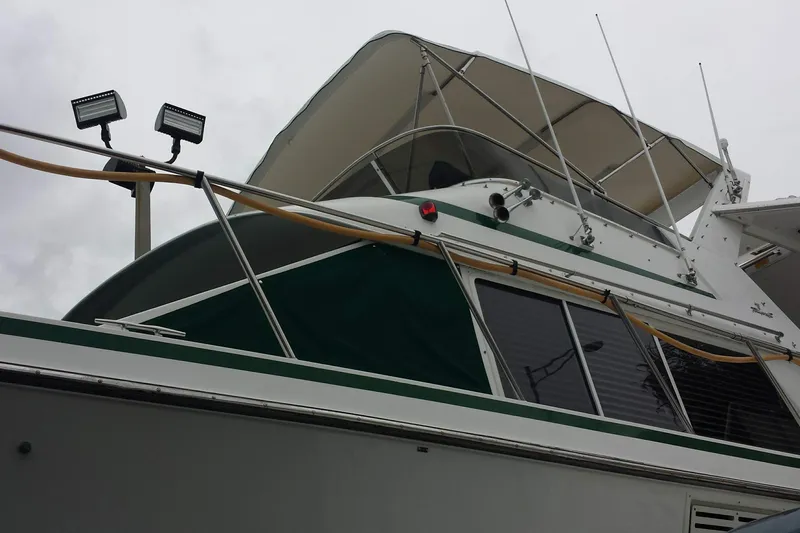 Slide: The Image of 1993 Tollycraft 45 Cockpit Motor Yacht with canopy and deck lights, viewed from below. - 5