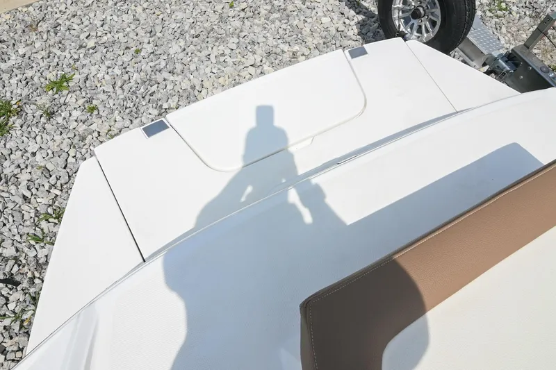 Slide: The Image of Shadow on the deck of a 2022 Cobalt CS22 boat, parked on gravel. - 14