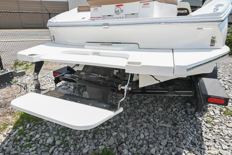 Slide: The Image of 2022 Cobalt CS22 boat rear view with swim platform and outboard motor. - 15