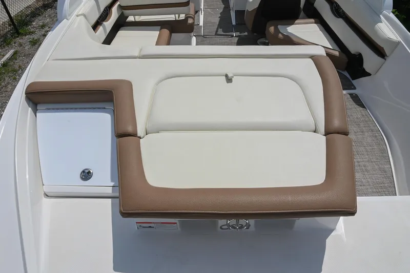 Slide: The Image of 2022 Cobalt CS22 boat interior with beige and brown seating. - 16