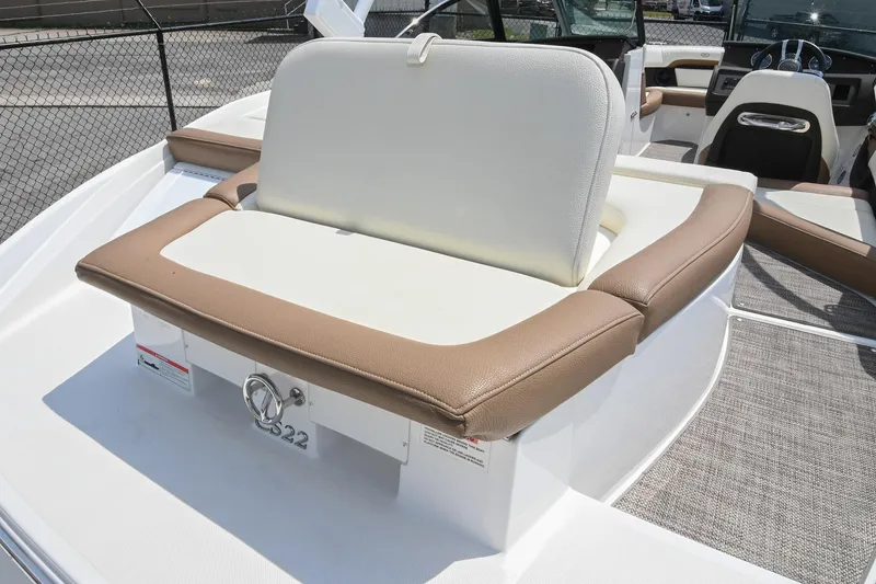 Slide: The Image of 2022 Cobalt CS22 boat interior with beige and white seating, showcasing luxury design. - 17