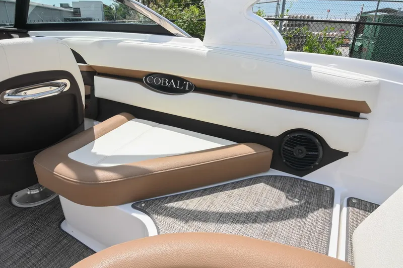 Slide: The Image of Interior of 2022 Cobalt CS22 boat with brown and white seating. - 19