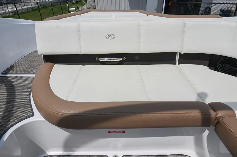 Slide: The Image of 2022 Cobalt CS22 boat interior with white and brown seating. - 22