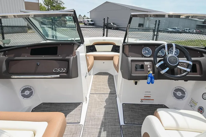 Slide: The Image of 2022 Cobalt CS22 boat interior with modern dashboard and steering wheel. - 27