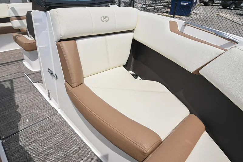 Slide: The Image of 2022 Cobalt CS22 boat interior with beige and white seating, showcasing luxury design. - 38