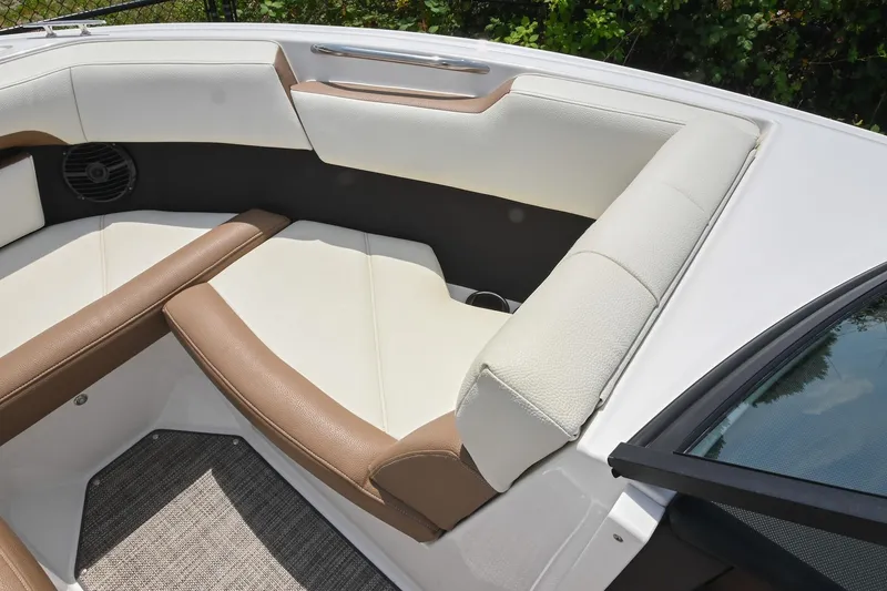 Slide: The Image of 2022 Cobalt CS22 boat interior with brown and white seating, showcasing luxury design. - 39