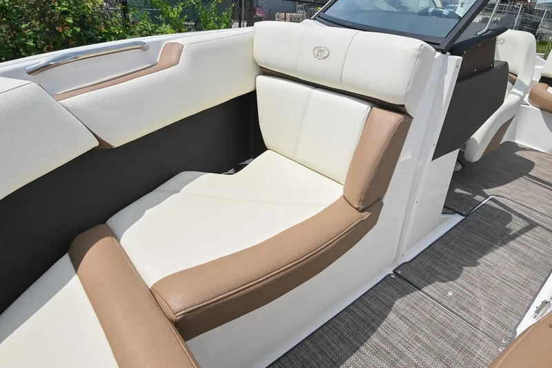 Slide: The Image of 2022 Cobalt CS22 boat interior with luxurious tan and white seating. - 40