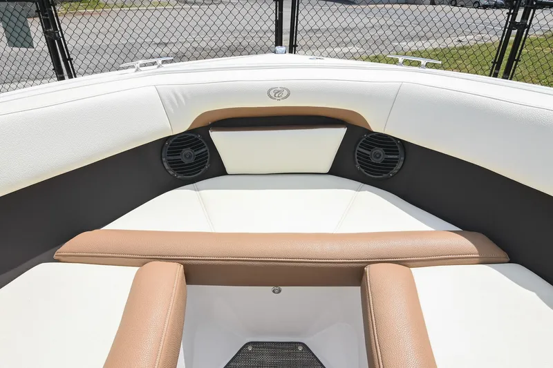 Slide: The Image of 2022 Cobalt CS22 boat interior with white and brown seating, featuring built-in speakers. - 41
