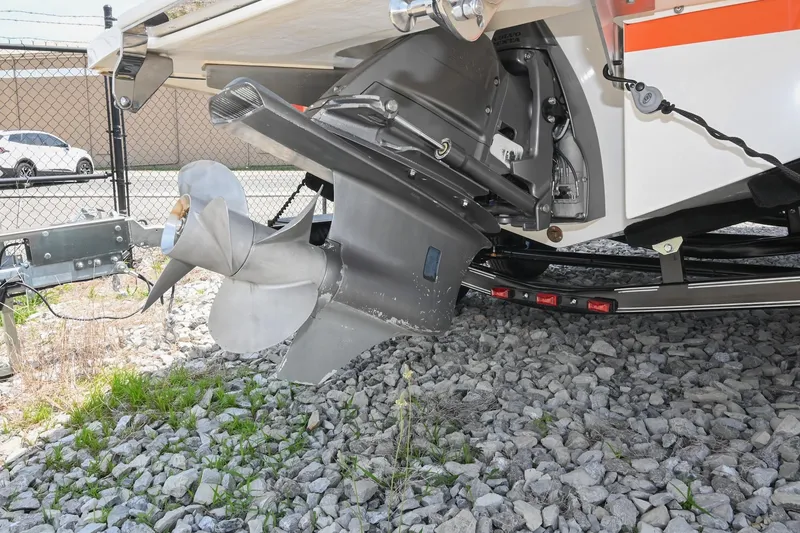 Slide: The Image of 2022 Cobalt CS22 boat propeller and outdrive on rocky ground. - 47