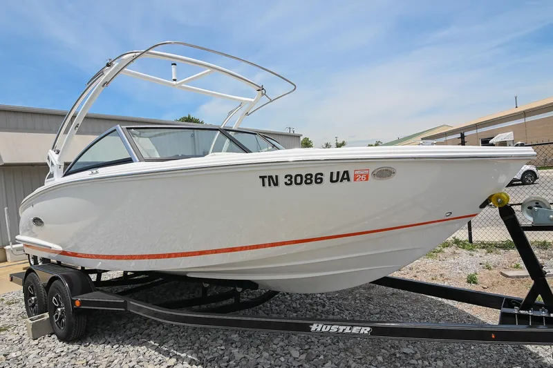 Slide: The Image of 2022 Cobalt CS22 boat on trailer, white exterior, parked outdoors on gravel. - 5