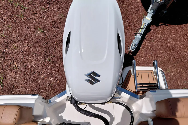 Slide: The Image of Top view of a 2026 Pioneer 180 Islander boat engine and seating area. - 23