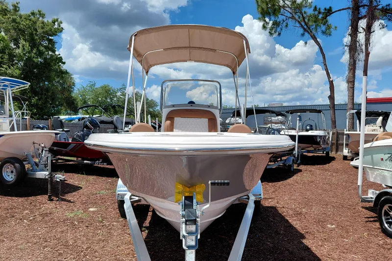 Slide: The Image of 2026 Pioneer 180 Islander boat on display under a sunny sky. - 3