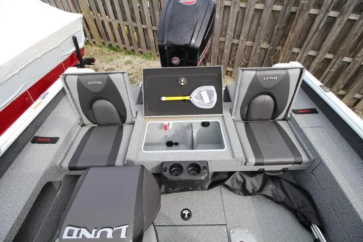 Slide: The Image of 2025 Lund 1775 Impact XS Sport boat interior with seating and storage compartments. - 8