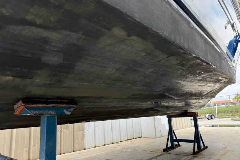 Slide: The Image of Bottom view of a 2010 Sea Ray 240 Sundancer boat on stands, showing hull details. - 6