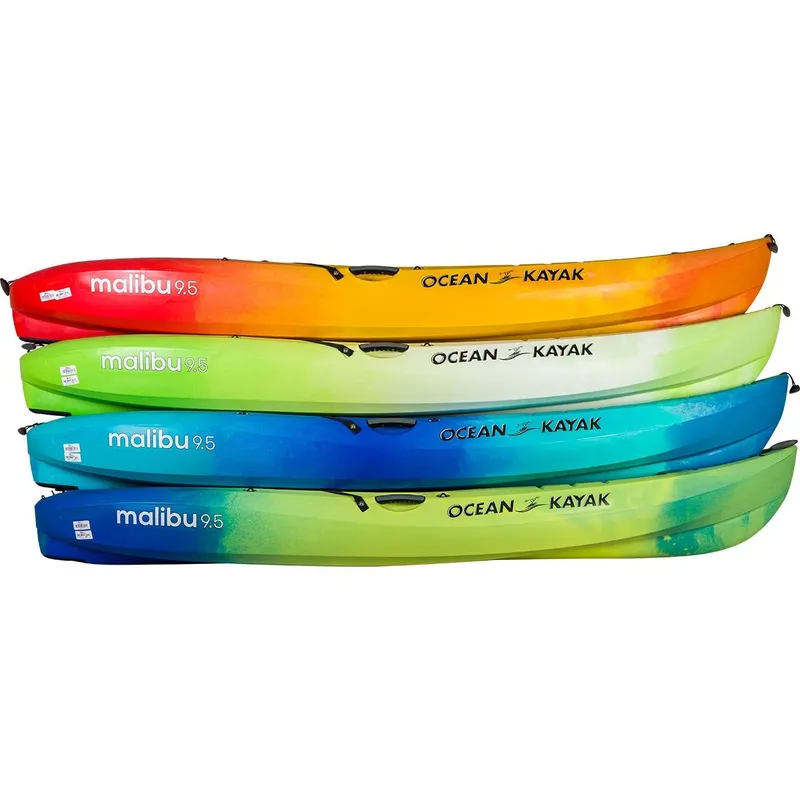 Slide: The Image of Colorful 2023 Ocean Kayak Malibu 9.5 kayaks stacked in a row. - 16