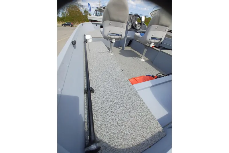Slide: The Image of 2021 G3 Guide V150 T boat interior with seating and steering wheel. - 12